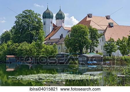"Benedictine monastery Seeon with monastery church of St. Lambert, Klostersee, Seebruck, Chiemgau, Upper Bavaria, Bavaria, Germany, Europe" View Large Photo Image Stock Image - "Benedictine monastery Seeon with monastery church of St. Lambert, Klostersee, Seebruck, Chiemgau, Upper Bavaria, Bavaria, Germany, Europe". Fotosearch