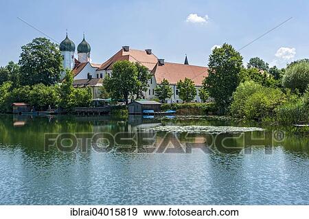 "Benedictine monastery Seeon with monastery church of St. Lambert, Klostersee, Seebruck, Chiemgau, Upper Bavaria, Bavaria, Germany, Europe" View Large Photo Image Stock Photo - "Benedictine monastery Seeon with monastery church of St. Lambert, Klostersee, Seebruck, Chiemgau, Upper Bavaria, Bavaria, Germany, Europe". Fotosearch