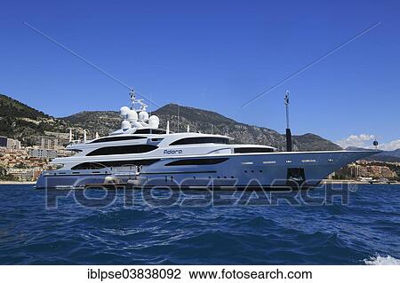 Benetti motor yacht Adora at anchor in front of the Principality of Monaco View Large Photo Image Stock Image - Benetti motor yacht Adora at anchor in front of the Principality of Monaco. Fotosearch