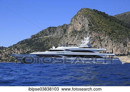 Stock Image - "Benetti motor yacht Silver Angel at anchor in front of Eze Bord de Mer, Maritime Alps, Provence Alpes Cote d'Azur, France, Europe". Fotosearch