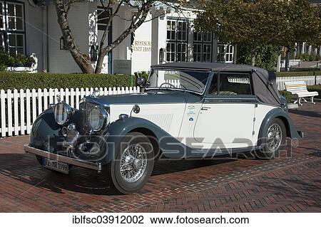 Stock Image - "Bentley, vintage car, parked in front of a hotel, Westerland, Sylt, North Frisia, Schleswig-Holstein, Germany, Europe". Fotosearch