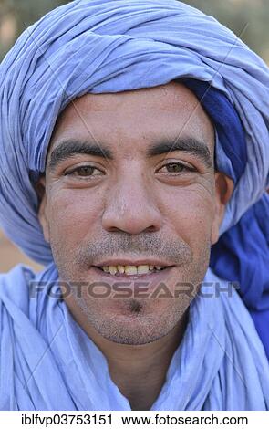 Stock Image - "Berber with light blue turban, Merzouga, Meknes-Tafilalet region, Morocco, Africa". Fotosearch