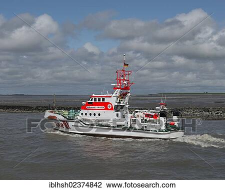 "Bernard Gruben, a SAR ship, sea rescue ship leaving the pier in Norddeich drining into the Wadden Sea, Lower Saxony, Germany, Europe" View Large Photo Image Stock Image - "Bernard Gruben, a SAR ship, sea rescue ship leaving the pier in Norddeich drining into the Wadden Sea, Lower Saxony, Germany, Europe". Fotosearch
