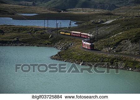 "Bernina Express, Raethische Bahn, at Lago Bianco reservoir, near Poschiavo, Canton of Graubunden, Switzerland, Europe" View Large Photo Image Picture - "Bernina Express, Raethische Bahn, at Lago Bianco reservoir, near Poschiavo, Canton of Graubunden, Switzerland, Europe". Fotosearch