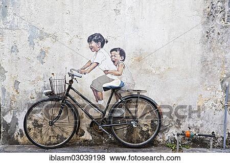 Stock Photo - "Bicycle in front of house wall with children painted as if they are riding the bike, street art, George Town, Penang, Malaysia, Asia". Fotosearch