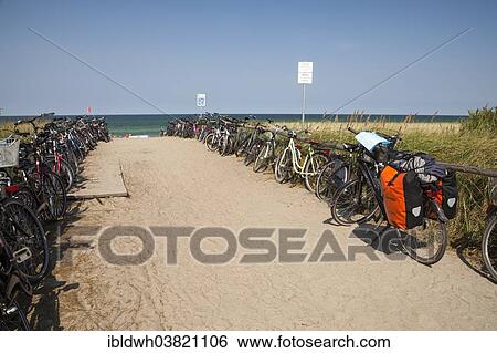 Stock Photograph - "Bicycles at the entrance to the beach, Baltic Sea peninsula of Fischland-Darss-Zingst, Baltic Sea resort of Zingst, Mecklenburg-Vorpommern, Germany, Europe". Fotosearch