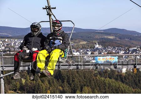 Bike park, downhill mountain bike trail at the Winterberg bobsleigh track, a converted ski lift is used to transport mountain bikers and their bikes up the mountain, Sauerland, North Rhine-Westphalia, Germany, Europe View Large Photo Image Stock Image - Bike park, downhill mountain bike trail at the Winterberg bobsleigh track, a converted ski lift is used to transport mountain bikers and their bikes up the mountain, Sauerland, North Rhine-Westphalia, Germany, Europe. Fotosearch
