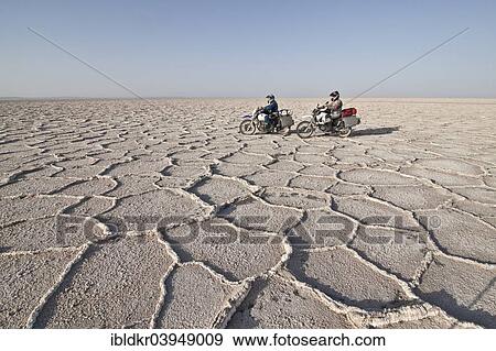 "Biker on a motorcycle trip, Dasht-e Kavir or Great Salt Desert, Marenjab, Maranjab, Semnan Province, Iran, Asia" View Large Photo Image Stock Photo - "Biker on a motorcycle trip, Dasht-e Kavir or Great Salt Desert, Marenjab, Maranjab, Semnan Province, Iran, Asia". Fotosearch