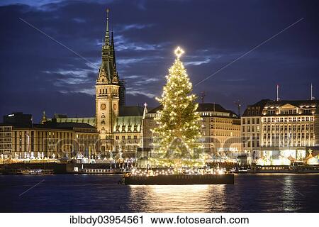 Stock Image - "Binnenalster lake with Christmas tree and Town Hall at Christmas time, Hamburg, Germany, Europe". Fotosearch