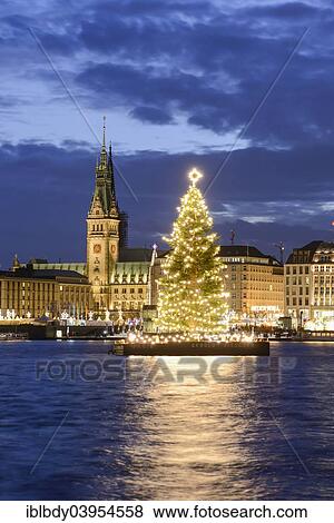 Stock Photo - "Binnenalster lake with Christmas tree and Town Hall at Christmas time, Hamburg, Germany, Europe". Fotosearch