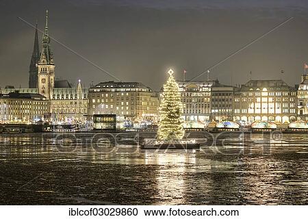 Stock Image - "Binnenalster or Inner Alster Lake with a Christmas tree, Hamburg City Hall and a Christmas market, Hamburg Neustadt, Hamburg, Hamburg, Germany, Europe". Fotosearch