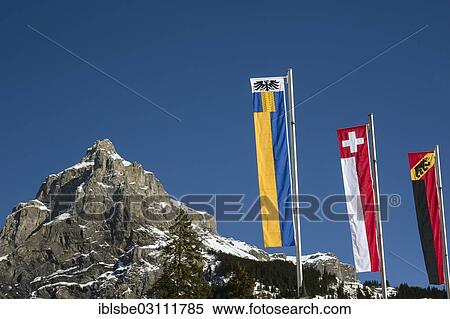 "Bire Mountain, 2502m, local mountain of Kandersteg, flags of Kandersteg, Switzerland and the canton of Bern, Bernese Alps, Kandersteg, Canton of Bern, Switzerland, Europe" View Large Photo Image Stock Photography - "Bire Mountain, 2502m, local mountain of Kandersteg, flags of Kandersteg, Switzerland and the canton of Bern, Bernese Alps, Kandersteg, Canton of Bern, Switzerland, Europe". Fotosearch