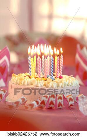 Birthday cake with burning candles View Large Photo Image Stock Image - Birthday cake with burning candles. Fotosearch