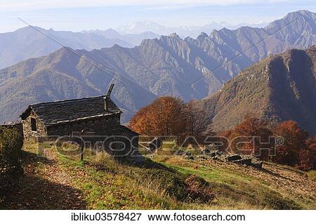 "Bivacco Alpe Curgei mountain hut in autumn, Val Grande National Park, Verbano-Cusio-Ossola province, Piedmont, Italy, Europe" View Large Photo Image Stock Photo - "Bivacco Alpe Curgei mountain hut in autumn, Val Grande National Park, Verbano-Cusio-Ossola province, Piedmont, Italy, Europe". Fotosearch