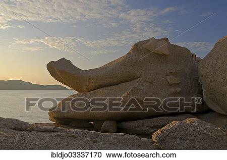 "Bizarre granite rocks at the coast of the mediterranean sea in Calvi below a blue sky with some clouds. Calvi is in the department Haute-Corse, France on the mediterranean island of Corsica, Calvi, Corsica, France, Europe" View Large Photo Image Stock Image - "Bizarre granite rocks at the coast of the mediterranean sea in Calvi below a blue sky with some clouds. Calvi is in the department Haute-Corse, France on the mediterranean island of Corsica, Calvi, Corsica, France, Europe". Fotosearch