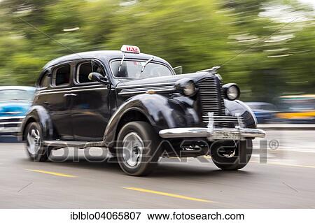 Stock Photo - "Black classic car on the street, Havana, Cuba, North America". Fotosearch