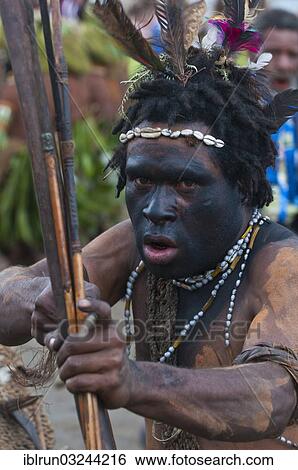 "Black decorated and painted man celebrating the traditional Sing Sing in the highlands, Enga, Highlands, Papua New Guinea, Oceania" View Large Photo Image Stock Photograph - "Black decorated and painted man celebrating the traditional Sing Sing in the highlands, Enga, Highlands, Papua New Guinea, Oceania". Fotosearch