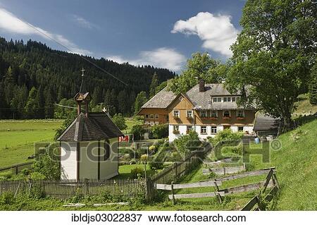 Stock Photo - "Black forest farmhouse with a chapel and a cottage garden, Feldberg, Bruderhalde, Black Forest, Baden-Wurttemberg, Germany, Europe". Fotosearch