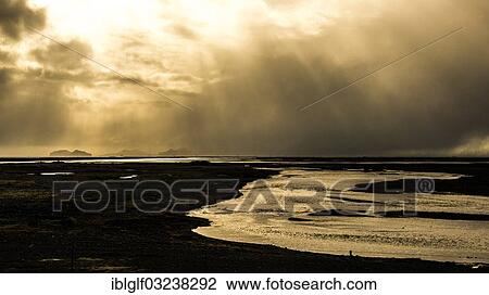 Stock Image - "Black glacial river flowing from Eyafjallajoekull Glacier, Thorsmork, Eyafjallajokull, Southern Region, Iceland, Europe". Fotosearch