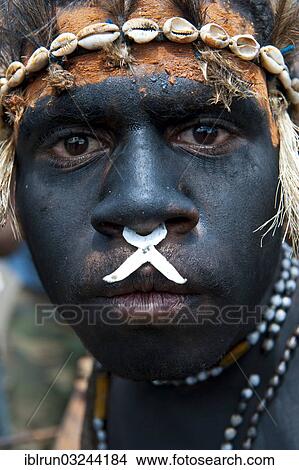 "Black painted and decorated man during the traditional Sing Sing in the highlands, Enga, Highlands, Papua New Guinea, Oceania" View Large Photo Image Picture - "Black painted and decorated man during the traditional Sing Sing in the highlands, Enga, Highlands, Papua New Guinea, Oceania". Fotosearch