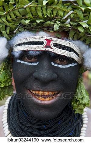 "Black painted man celebrating the traditional Sing Sing in the highlands, Enga, Highlands, Papua New Guinea, Oceania" View Large Photo Image Stock Image - "Black painted man celebrating the traditional Sing Sing in the highlands, Enga, Highlands, Papua New Guinea, Oceania". Fotosearch