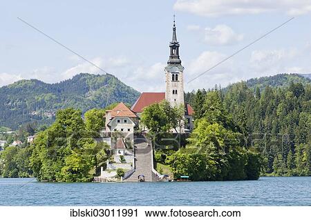 Stock Image - "Blejski Otok Island with St. Mary's Church in Lake Bled in Bled, Slovenia, Europe, Bled, Upper Carniola, Slovenia, Europe". Fotosearch