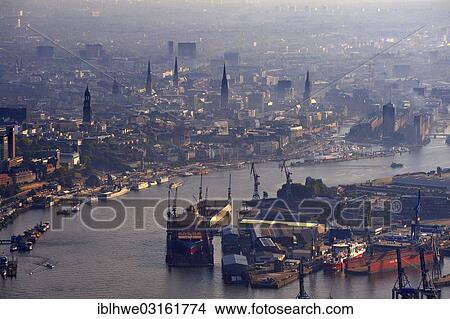 Picture - "Blohm and Voss shipyard with floating docks in the Elbe River, in the morning, Hamburg, Hamburg, Germany, Europe". Fotosearch