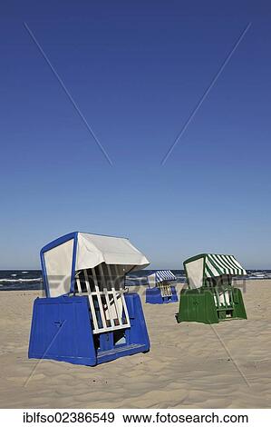 "Blue and white roofed beach chairs on the beach near Goehren, with copy space, Baltic Sea resort town of Goehren, Ruegen, Mecklenburg-Western Pomerania, Germany, Europe" View Large Photo Image Stock Photo - "Blue and white roofed beach chairs on the beach near Goehren, with copy space, Baltic Sea resort town of Goehren, Ruegen, Mecklenburg-Western Pomerania, Germany, Europe". Fotosearch