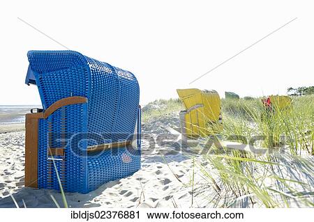Stock Image - "Blue beach chair on the beach of Wyk, Foehr island, North Frisia, Schleswig-Holstein, Germany, Europe". Fotosearch