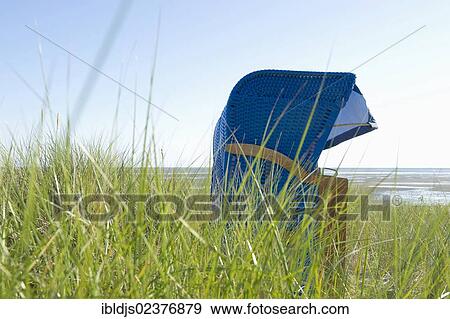 Stock Photo - "Blue beach chair on the beach of Wyk, Foehr island, North Frisia, Schleswig-Holstein, Germany, Europe". Fotosearch