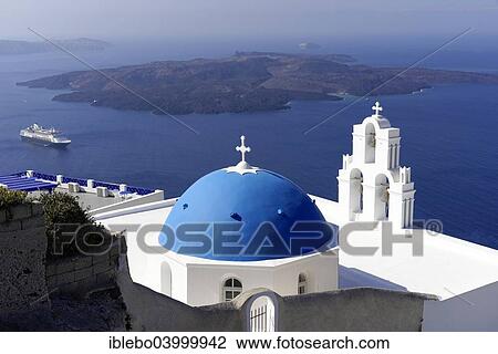 Stock Image - "Blue dome and bell tower of a Byzantine Orthodox church, caldera, Oia, Santorini, Cyclades, Greece, Europe". Fotosearch