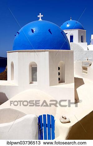 Stock Image - "Blue domed Byzantine Orthodox churches, Oia, Santorini, Greek Cyclades islands". Fotosearch