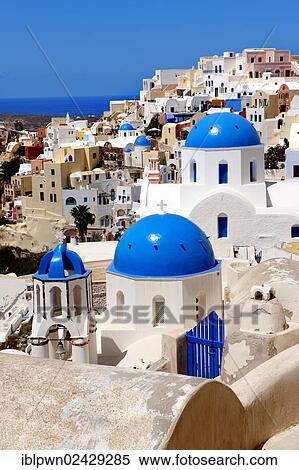 Stock Photography - "Blue domed Byzantine Orthodox churches, Cyclades Islands, Oia, Ia, Santorini, Greece, Europe". Fotosearch