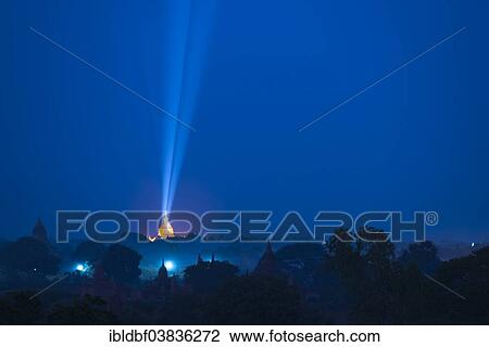 Stock Image - "Blue hour, dusk, illuminated temple, stupa, pagoda, temple complex in the Bagan plains, Mandalay Region, Myanmar, Asia". Fotosearch