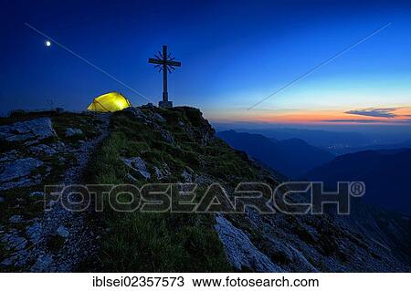 "Blue hour with a mountain panorama and a tent at the summit cross, Geisshorn Mountain, Tannheim Valley, Tyrol, Austria, Europe" View Large Photo Image Stock Image - "Blue hour with a mountain panorama and a tent at the summit cross, Geisshorn Mountain, Tannheim Valley, Tyrol, Austria, Europe". Fotosearch