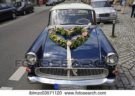 "Blue Opel Rekord P1 car, in use as a wedding car with floral decorations on the hood, Hassfurt, Lower Franconia, Bavaria, Germany, Europe" View Large Photo Image Stock Image - "Blue Opel Rekord P1 car, in use as a wedding car with floral decorations on the hood, Hassfurt, Lower Franconia, Bavaria, Germany, Europe". Fotosearch