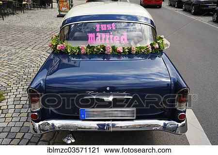 "Blue Opel Rekord P1 car, in use as a wedding car, with the lettering """"just married"""" in the rear window, Hassfurt, Lower Franconia, Bavaria, Germany, Europe" View Large Photo Image Stock Image - "Blue Opel Rekord P1 car, in use as a wedding car, with the lettering """"just married"""" in the rear window, Hassfurt, Lower Franconia, Bavaria, Germany, Europe". Fotosearch