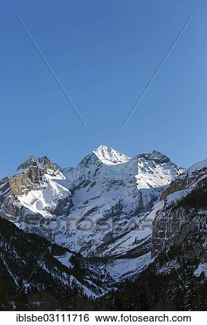 "Bluemlisalp Group, Blueemlisalp Rothorn Mountain on the left, Bluemlisalphorn Mountain in the centre and Oeschinenhorn Mountain on the right, winter, view from Kandersteg, Bernese Alps, Kandersteg, Canton of Bern, Switzerland, Europe" View Large Photo Image Stock Photograph - "Bluemlisalp Group, Blueemlisalp Rothorn Mountain on the left, Bluemlisalphorn Mountain in the centre and Oeschinenhorn Mountain on the right, winter, view from Kandersteg, Bernese Alps, Kandersteg, Canton of Bern, Switzerland, Europe". Fotosearch
