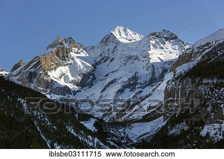 "Bluemlisalp Group, Blueemlisalp Rothorn Mountain on the left, Bluemlisalphorn Mountain in the centre and Oeschinenhorn Mountain on the right, winter, view from Kandersteg, Bernese Alps, Kandersteg, Canton of Bern, Switzerland, Europe" View Large Photo Image Stock Photography - "Bluemlisalp Group, Blueemlisalp Rothorn Mountain on the left, Bluemlisalphorn Mountain in the centre and Oeschinenhorn Mountain on the right, winter, view from Kandersteg, Bernese Alps, Kandersteg, Canton of Bern, Switzerland, Europe". Fotosearch