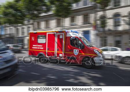 "Blurred French emergency vehicle rushing through city street with blue lights flashing, Saintes, Poitou-Charentes, France, Europe" View Large Photo Image Stock Photograph - "Blurred French emergency vehicle rushing through city street with blue lights flashing, Saintes, Poitou-Charentes, France, Europe". Fotosearch