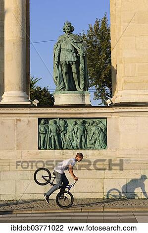 "BMX cyclist in front of the Millennium Monument in Heroes' Square, Budapest, Hungary, Europe" View Large Photo Image Stock Image - "BMX cyclist in front of the Millennium Monument in Heroes' Square, Budapest, Hungary, Europe". Fotosearch