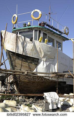 Stock Photo - "Boat being repaired, fishing port, Chernomorets, Bulgaria, Europe". Fotosearch