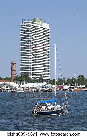 "Boat, high-rise building, Travemunde, Schleswig-Holstein, Germany, Europe" View Large Photo Image Stock Image - "Boat, high-rise building, Travemunde, Schleswig-Holstein, Germany, Europe". Fotosearch