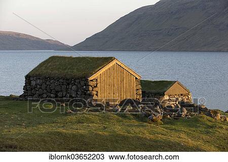 "Boat houses, traditional sod houses on Lake Sorvagsvatn or Leitisvatn, evening mood, Vagar oder Vagar, Faroe Islands, Denmark, Europe" View Large Photo Image Stock Image - "Boat houses, traditional sod houses on Lake Sorvagsvatn or Leitisvatn, evening mood, Vagar oder Vagar, Faroe Islands, Denmark, Europe". Fotosearch