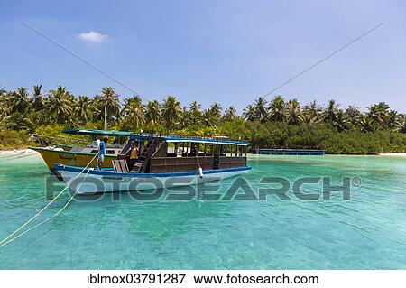 "Boat in front of a Maldives island, Embudu, North Male Atoll, Maldives, Asia" View Large Photo Image Stock Photo - "Boat in front of a Maldives island, Embudu, North Male Atoll, Maldives, Asia". Fotosearch