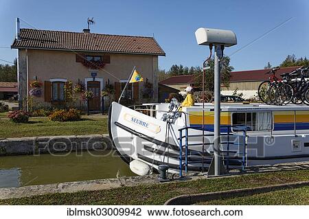"Boat in the lock chamber waiting locking to go downstream, lock No. 45 at Corre, PK 146, on the Canal des Vosges, formerly Canal de l'Est, Corre, Vesoul, Haute-Saone, Franche-Comte, France, Europe" View Large Photo Image Stock Image - "Boat in the lock chamber waiting locking to go downstream, lock No. 45 at Corre, PK 146, on the Canal des Vosges, formerly Canal de l'Est, Corre, Vesoul, Haute-Saone, Franche-Comte, France, Europe". Fotosearch