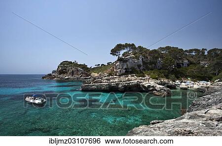 "Boat in the rock-lined bay of Calo des Moro, Santanyi, Mallorca, Majorca, Balearic Islands, Spain, Europe" View Large Photo Image Stock Photograph - "Boat in the rock-lined bay of Calo des Moro, Santanyi, Mallorca, Majorca, Balearic Islands, Spain, Europe". Fotosearch