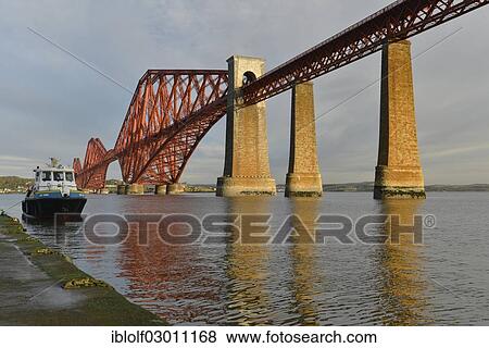 "Boat jetty next to Forth Bridge railway bridge across Firth of Forth, Queensferry, Edinburgh, Scotland, United Kingdom, Europe" View Large Photo Image Stock Photo - "Boat jetty next to Forth Bridge railway bridge across Firth of Forth, Queensferry, Edinburgh, Scotland, United Kingdom, Europe". Fotosearch