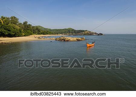 Stock Image - "Boat off Om Beach, Gokarna, Karnataka, India, Asia". Fotosearch