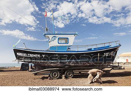 Picture - "Boat on a trailer, El Cotillo, Fuerteventura, Canary Islands, Spain, Europe". Fotosearch